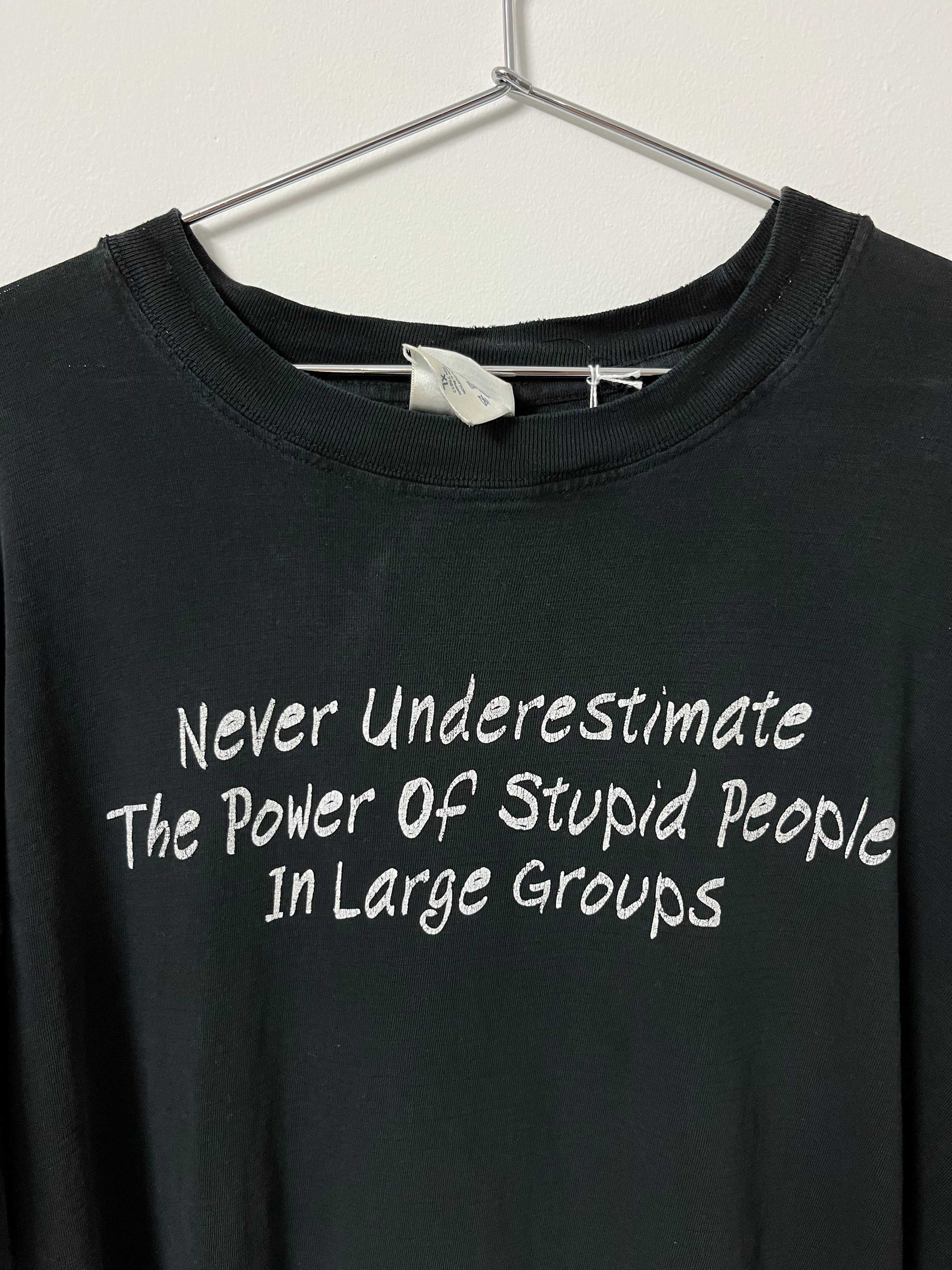 Late 90s/Early ‘00s ‘Never Underestimate the Power of Stupid People’ Distressed T-Shirt - Faded Black - L/XL