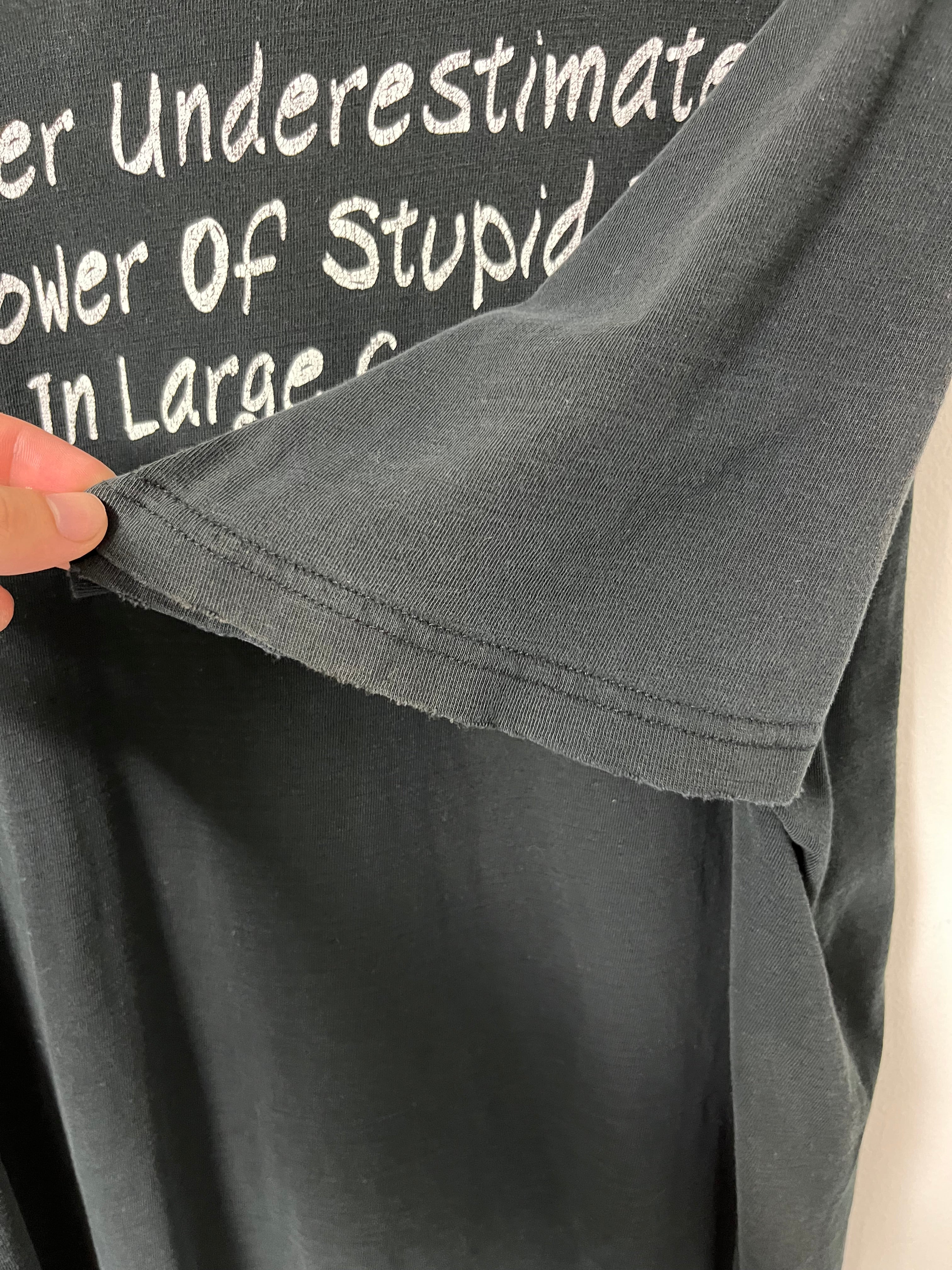 Late 90s/Early ‘00s ‘Never Underestimate the Power of Stupid People’ Distressed T-Shirt - Faded Black - L/XL